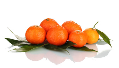 Ripe tasty tangerines with leaves isolated on white