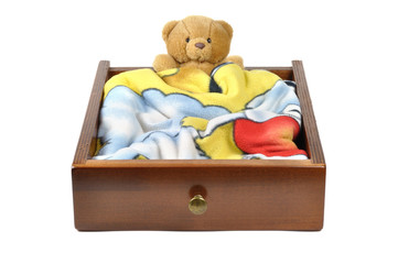 Teddy bear in a wooden drawer