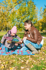 The young woman with the daughter on walk