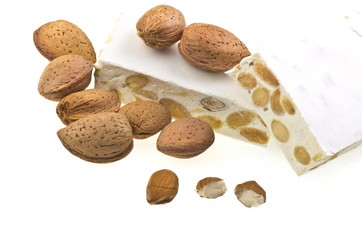 Nougat with almonds on the white