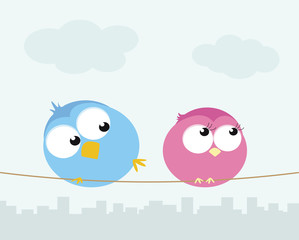 Two cartoon birds sitting on a wire