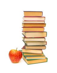 red apple and a big stack of books on white background