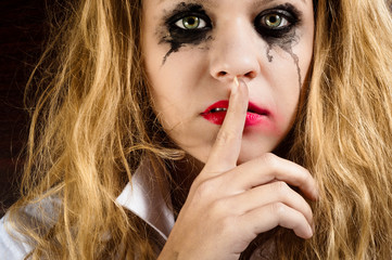 Naklejka premium Silence, showed by a sad girl