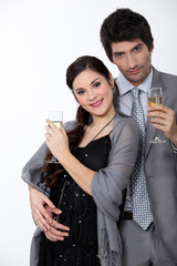 Glamorous couple drinking champagne