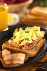 Fried bacon and scrambled egg on toast bread