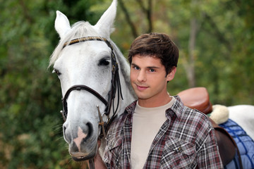 man strolling with horse