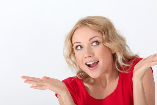 Portrait of woman with red shirt having surprised look