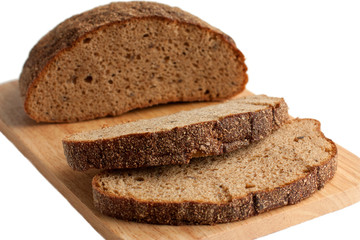 A delicious brown bread on the cutting board