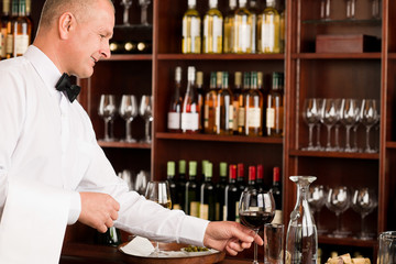 Wine bar waiter mature serve glass restaurant
