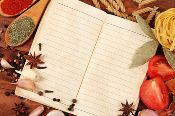 Naklejka na ściany i meble notebook for recipes and spices on wooden table