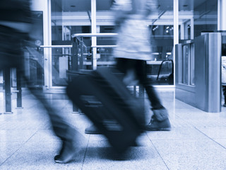 Rushing travelers with luggage