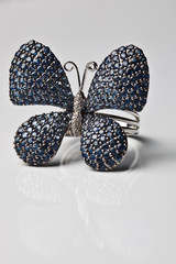 Ring in the shape of a butterfly with diamonds and sapphires