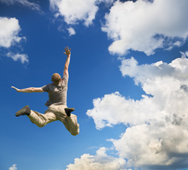 Obraz premium Man jump to sky.