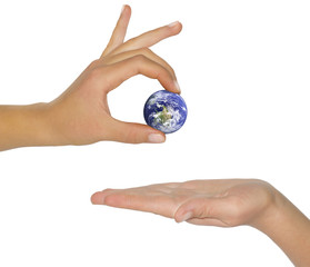 female hand holding earth.