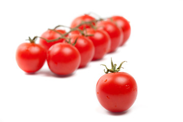 Close-up of wet Cherry tomatoes on white