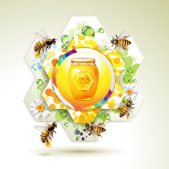 Glass jar with bee and honeycomb