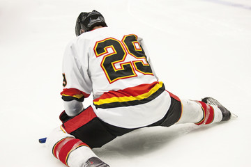 Naklejka premium Ice Hockey Player Stretching
