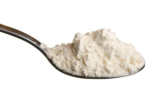 White wheat flour powder in a spoon