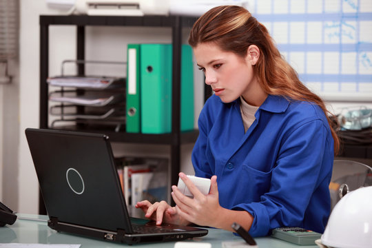 craftswoman working in the office of her company