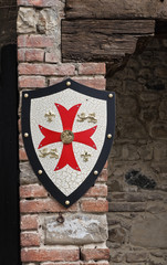 Shield on wall. Grazzano Visconti. Emilia-Romagna. Italy.