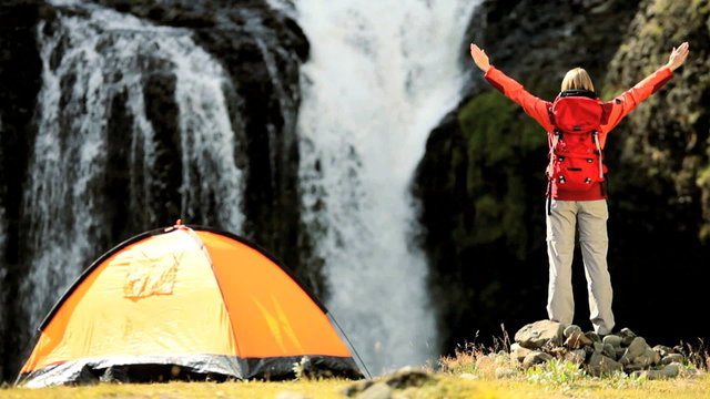 Female Hiker Celebrating Expedition Success