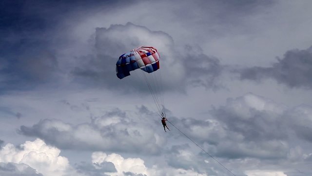 Parasailing, flying with parachute