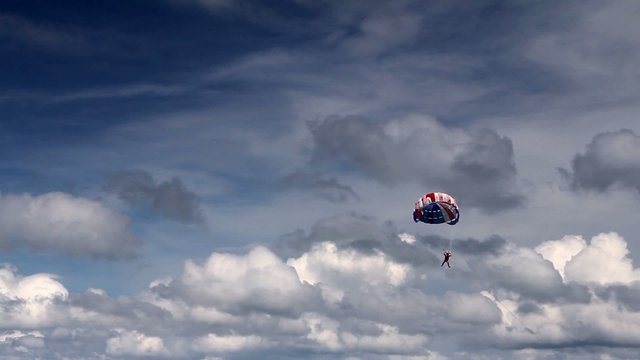 Parasailing, flying with parachute