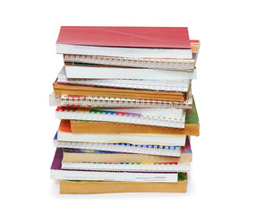 A vertical stack of books and pamphlets