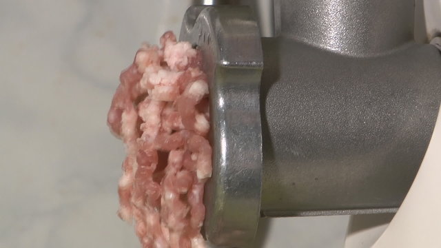 Forcemeat preparation in an electric meat grinder.