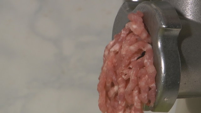 Forcemeat preparation in an electric meat grinder.