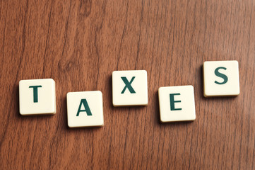 Taxes word made by letter pieces