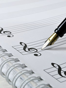 Blank sheet music with fountain pen