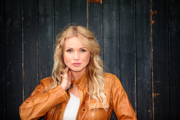 Portrait of beautiful blond woman with leather jacket