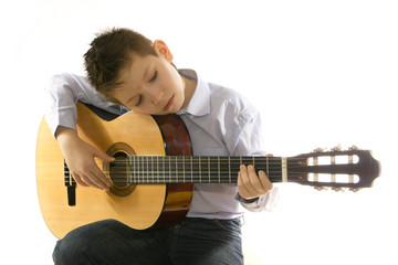 boy with an acoustic guitar isolated on white
