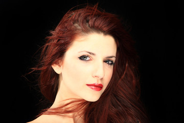 Fototapeta premium Glamour portrait of a woman on black