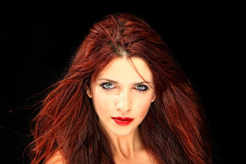 Fototapeta premium Glamour portrait of a woman on black