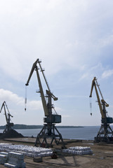 three cargo cranes at the port