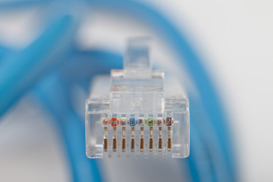 RJ45 cable on gray background. Shallow DOF.