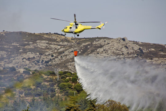 fire fighting helicopters fire on the mountain