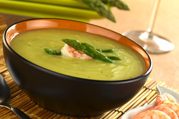 Cream of green asparagus with shrimp (Selective Focus)