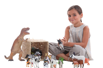 little girl with animal figurines