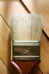 Paint brush on the wooden background