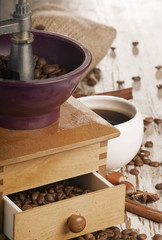 Fototapeta na wymiar Coffee grinder on a wooden table