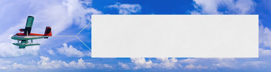 Flying airplane and banner