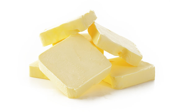 Piece of butter  on  white background