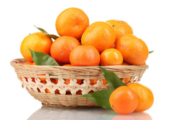 tangerines with leaves in a beautiful basket isolated on white
