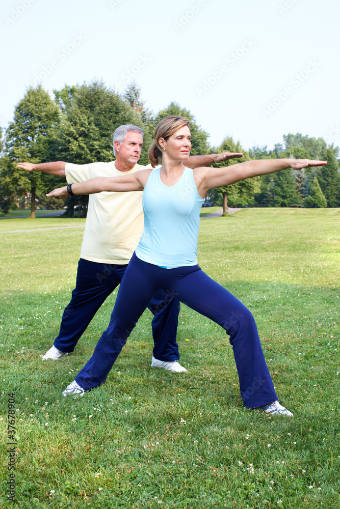 Canvas Prints Senior couple doing yoga.