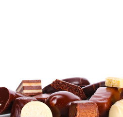 Many different chocolate candy isolated on white