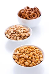 Gordijnen Party snacks: Cashew, Peanuts and Pretzels © victoria p.