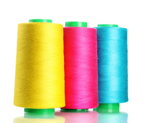 Bobbins of thread isolated on white